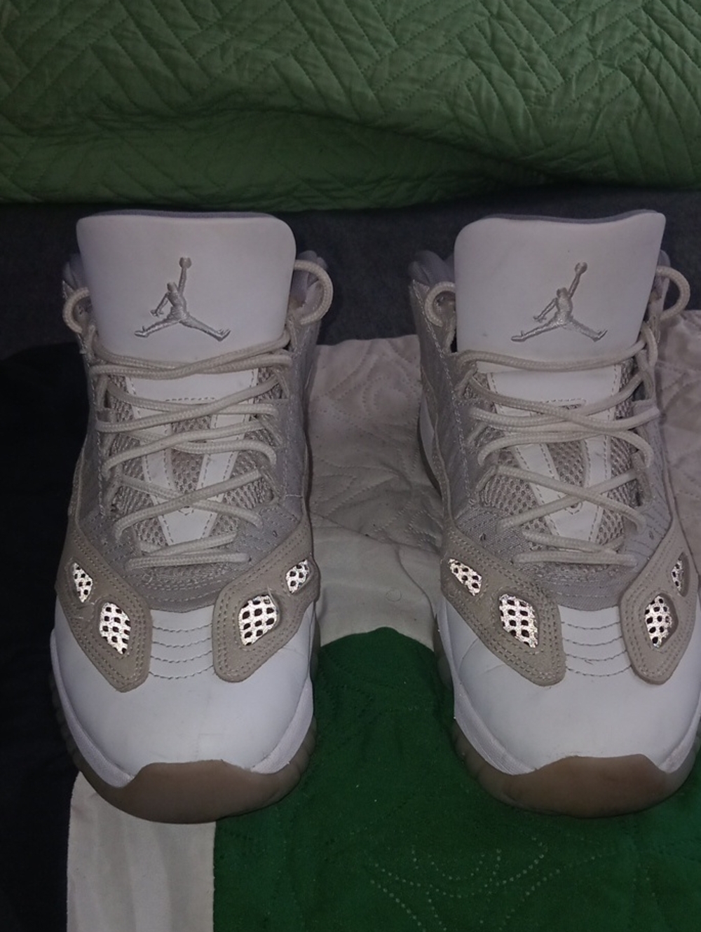 These are Nike Air Jordan 11 Retro Low IE sneakers in the "Light Orewood Brown"